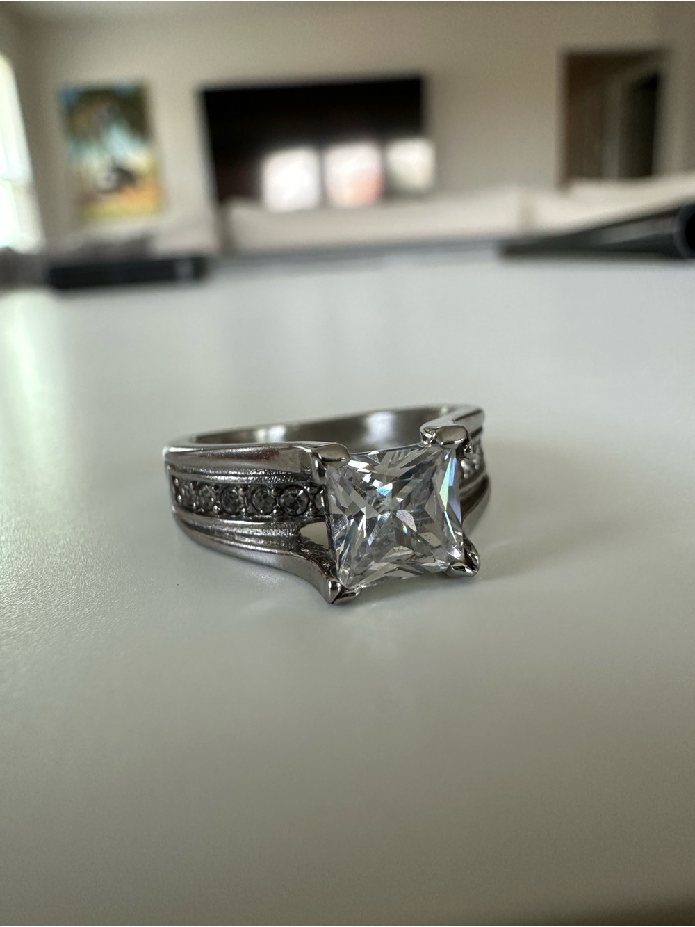 Classic PrincessCut Engagement Ring in Silver Tone with CZ Stone accents on band
